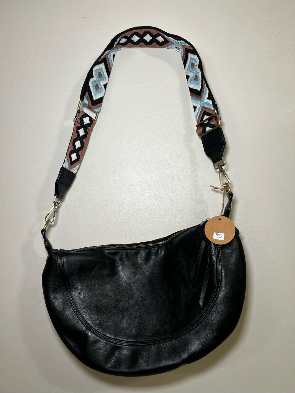 Black Crescent Crossbody Bag with Patterned Strap